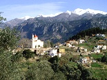 Church dwarfed by snow-capped mountains