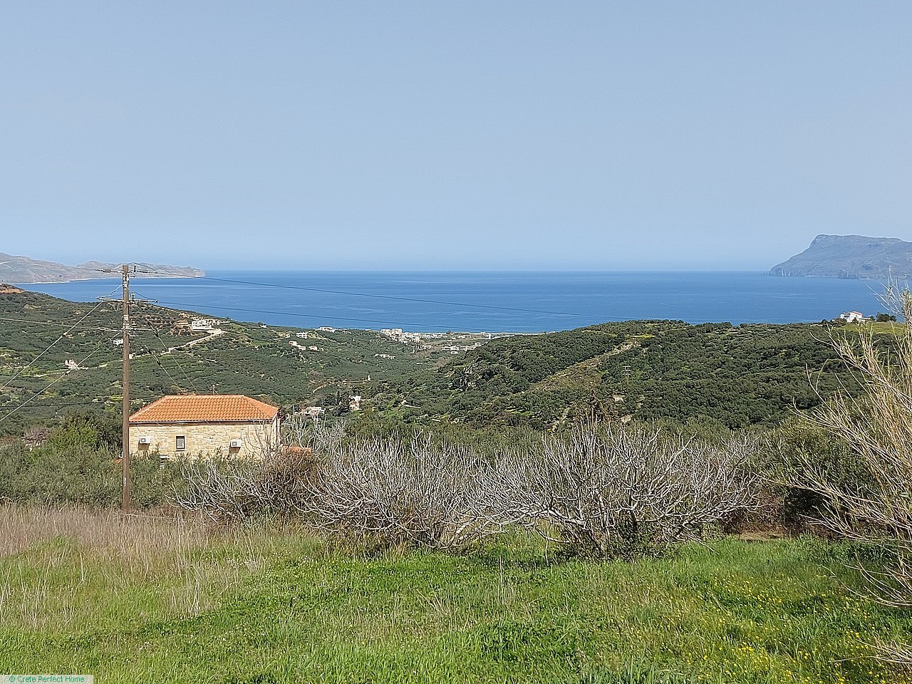Large elevated village plot, panoramic sea views, huge build allowance, ideal for tourism